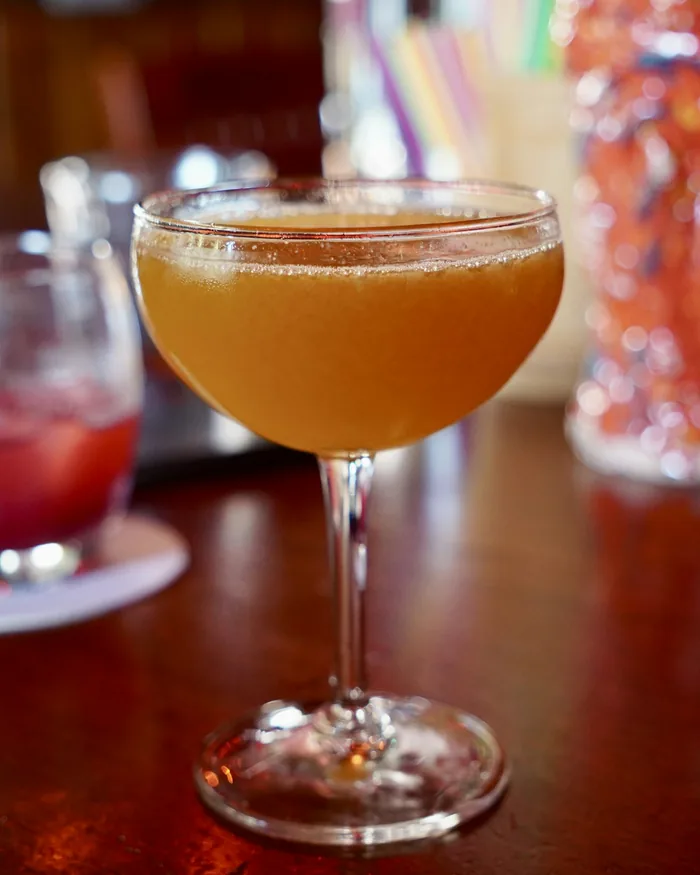 Sample photo: a cocktail in a coupe glass in warm light