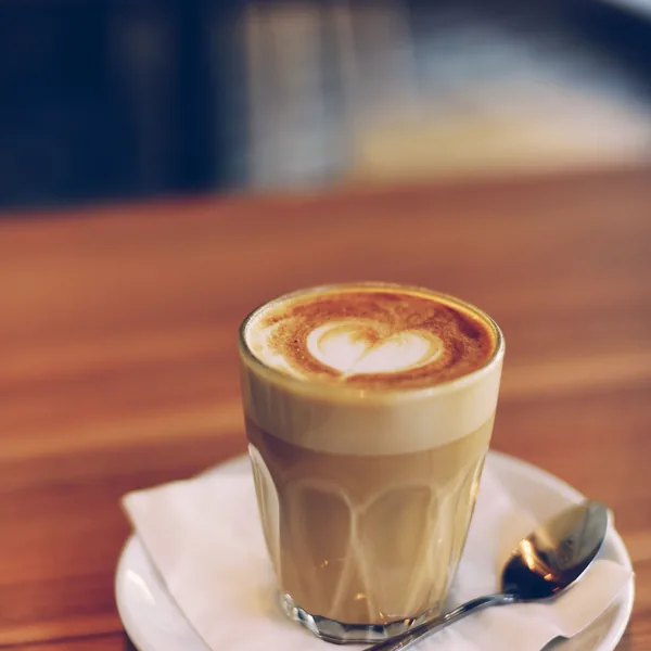 Sample photo: a latte in a glass on a saucer