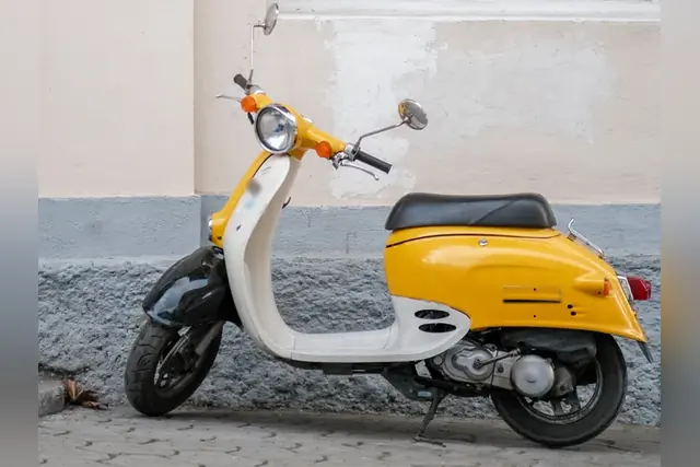 Yellow and white Honda Giorno scooter, example photo