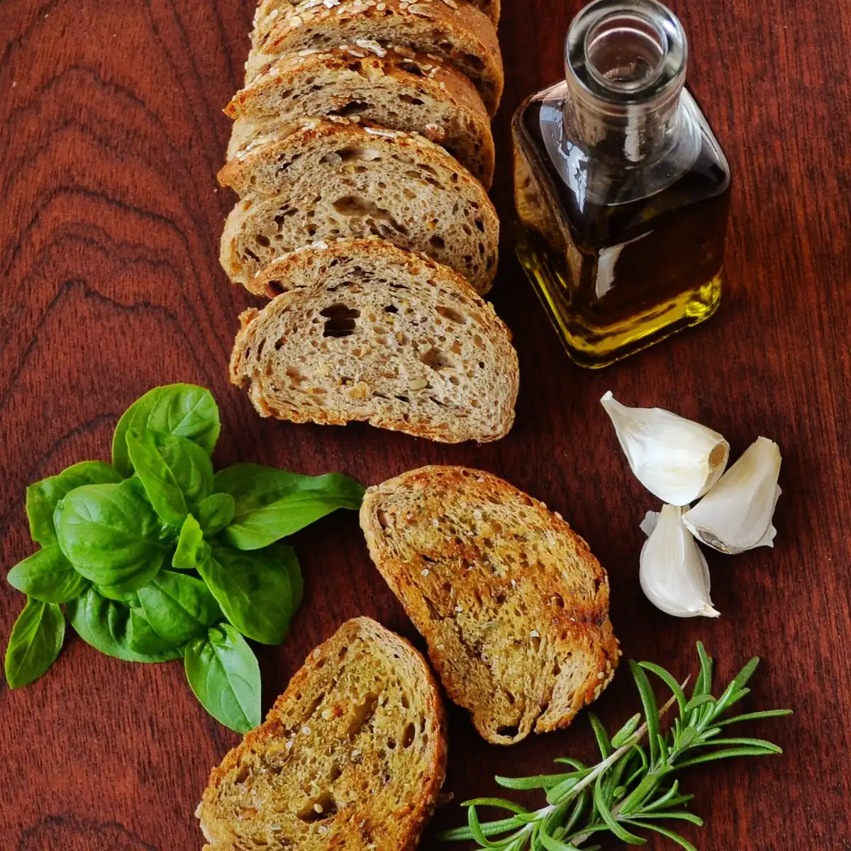 Sample photo: bread, olive oil, garlic and herbs on a board