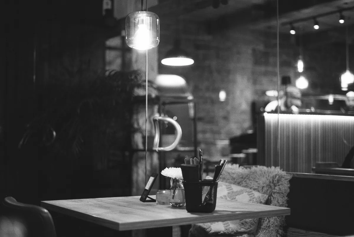 Sample photo: a dim, cosy dining room in black and white