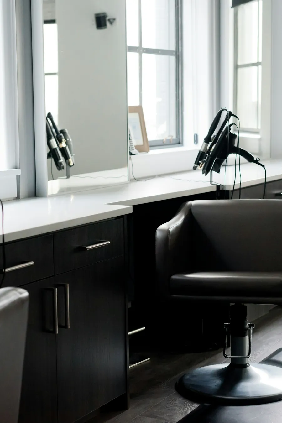 Salon styling stations by bright windows