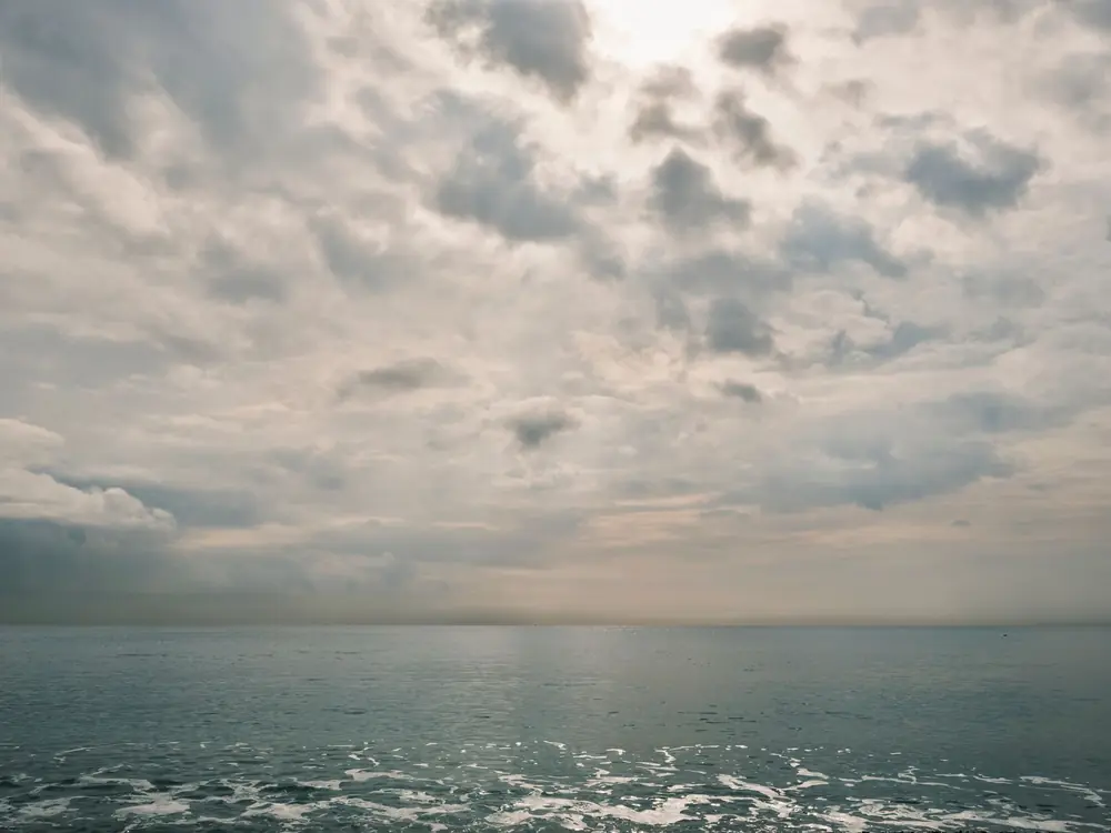 The sea, hazy in the distance.